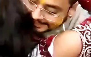 Cute Indian bride kissing publicly